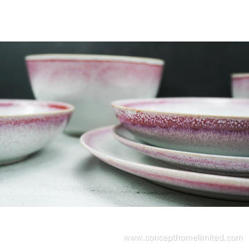 Reactive glazed stoneware dinner set with pink rim